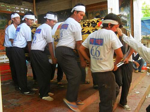 Ten pallbearers with the body